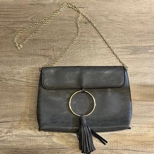 Banyan Tree grey clutch with ring and fringe detail with crossbody chain